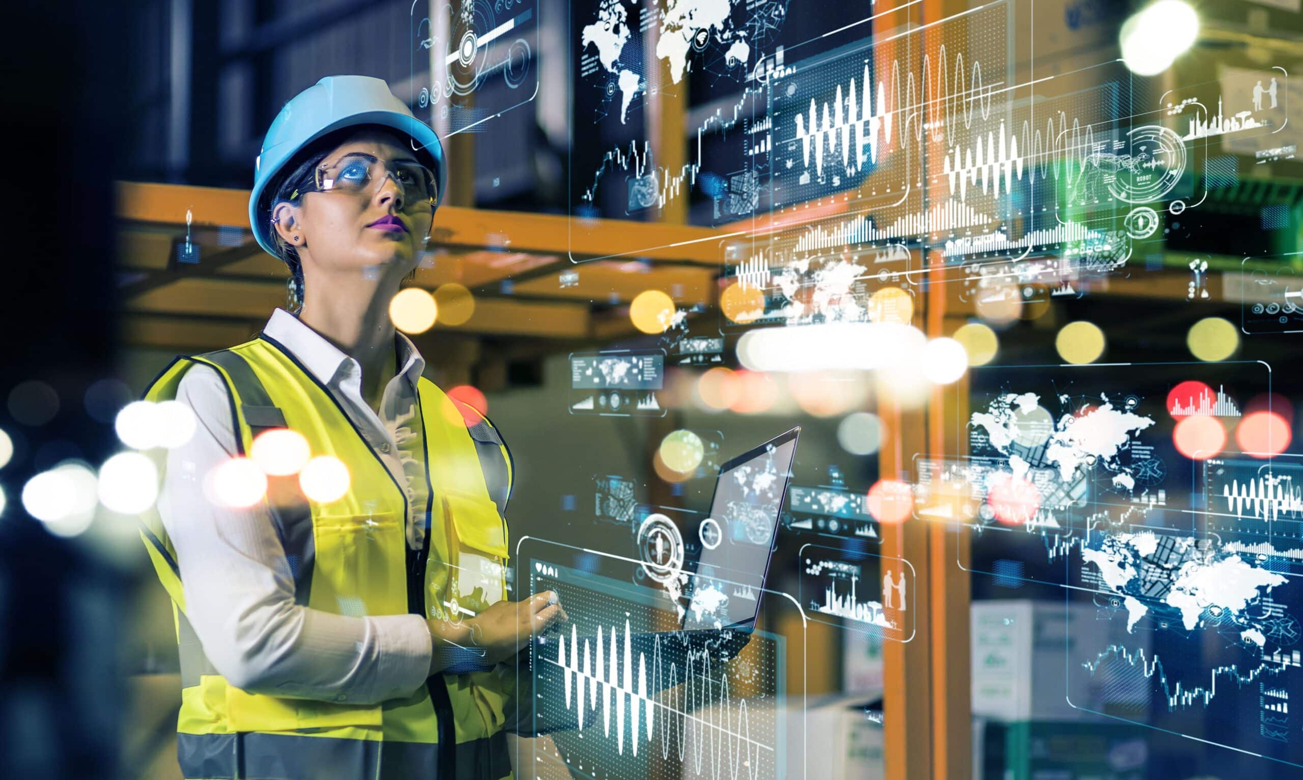 La photo met en avant la fusion de l'humain et de la technologie dans la Digital Factory, avec des travailleurs collaborant avec des machines intelligentes pour optimiser la production.